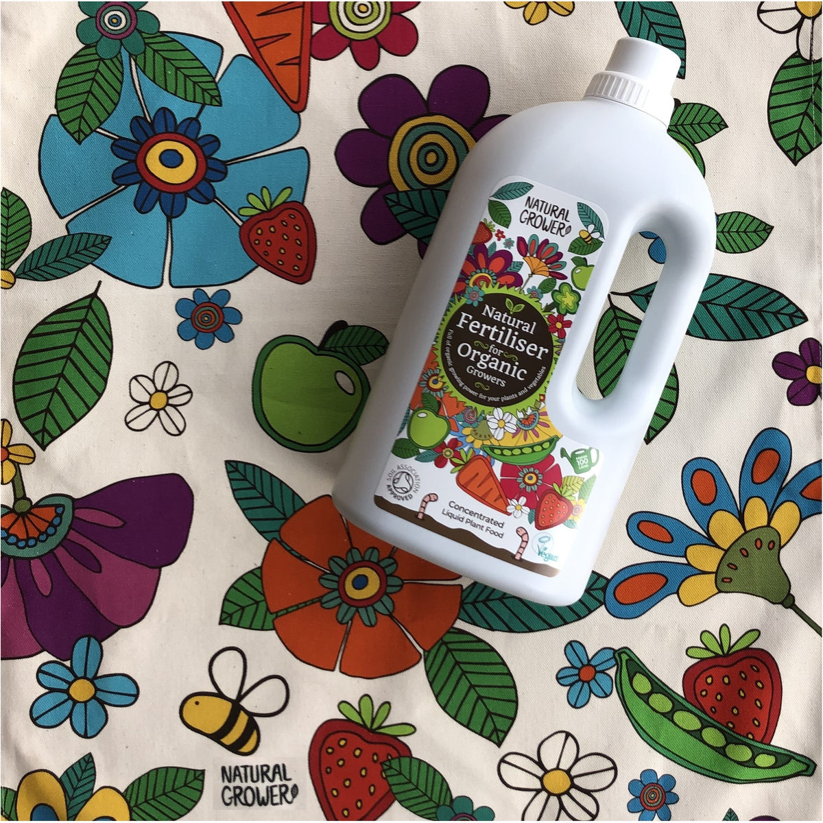 Natural Grower gardening gift set with 2L Liquid Fertiliser and Flower Power tea towel