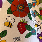 Natural Grower organic cotton tea towel with Flower Power botanical artwork