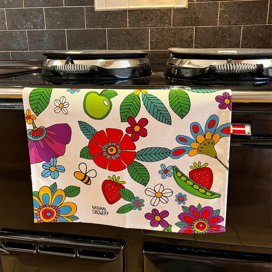 Natural Grower Flower Power organic cotton tea towel displayed in a kitchen